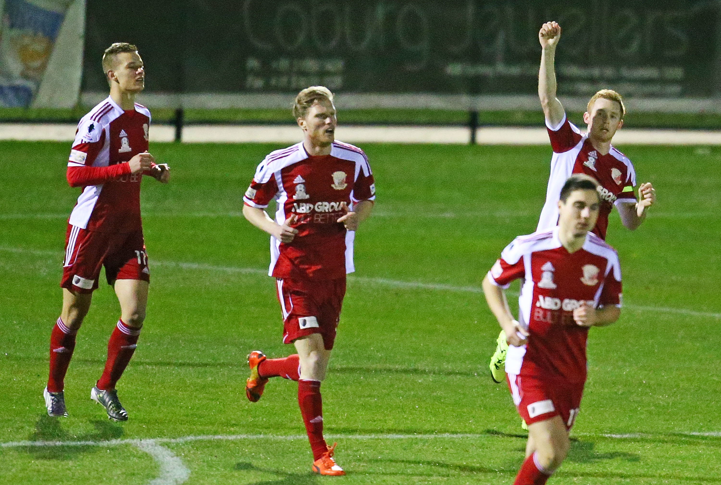 Nicholas Hegarty (R) of Hume City FC celebrates after scoring against Brisbane Strikers.
