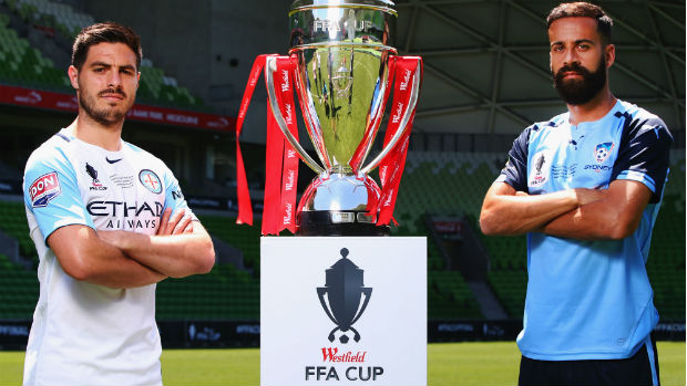 Captains Bruno Fornaroli and Alex Brosque alongside the Westfield FFA Cup trophy ahead of Wednesday night's Final.