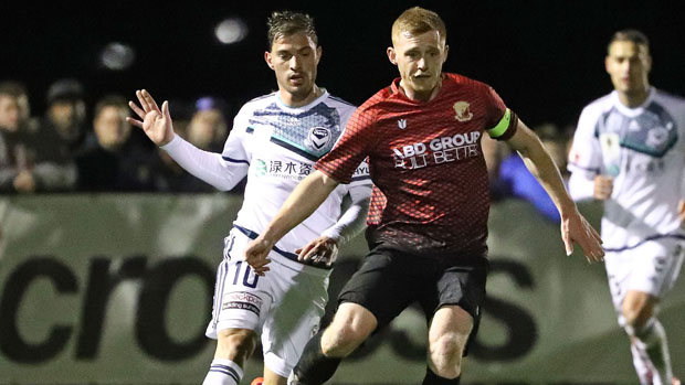 Nick Hegarty on the ball for Hume City against Melbourne Victory.