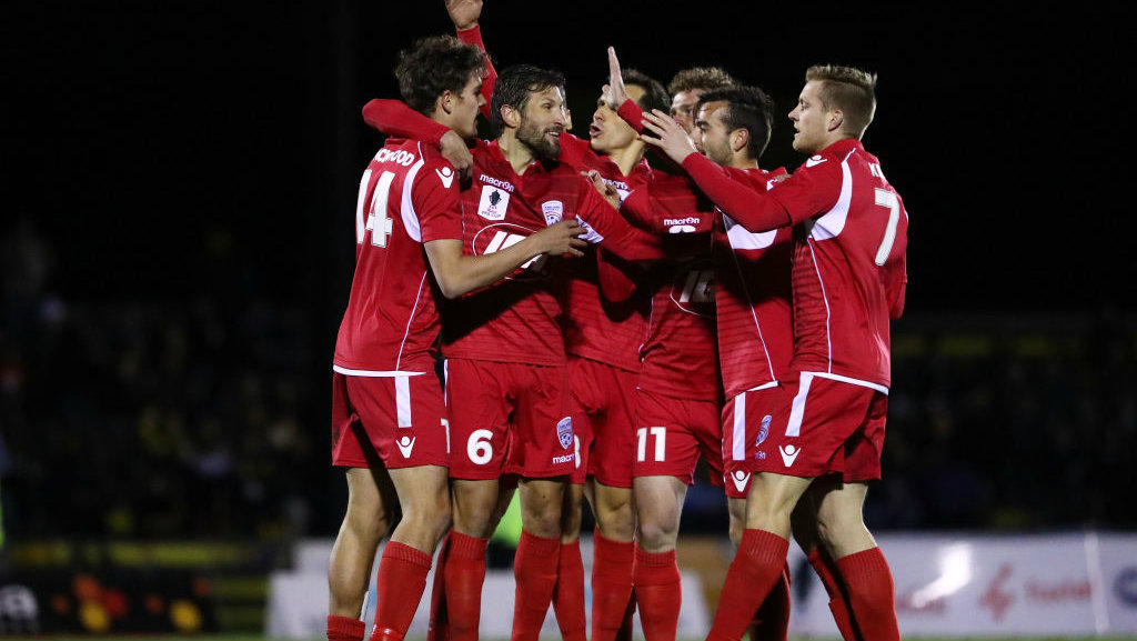 Adelaide United cruised into the semi finals with a 3-0 win over Heidelberg United.
