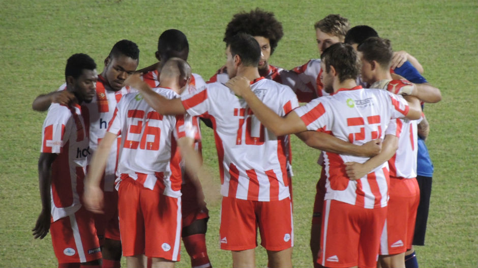Darwin Olympic players form a huddle before kick-off. Photo courtesy: Eddie Sepulveda