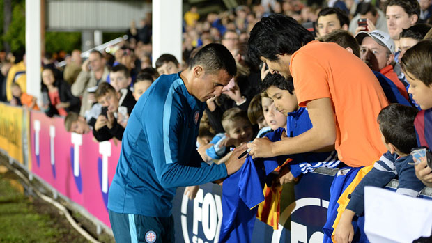 Tim Cahill signs autographs for fans at Perry Park in the FFA Cup.