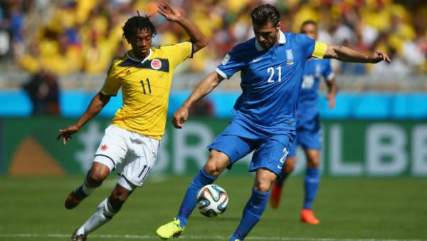 Kostas Katsouranis on the ball against Colombia at the 2014 World Cup.